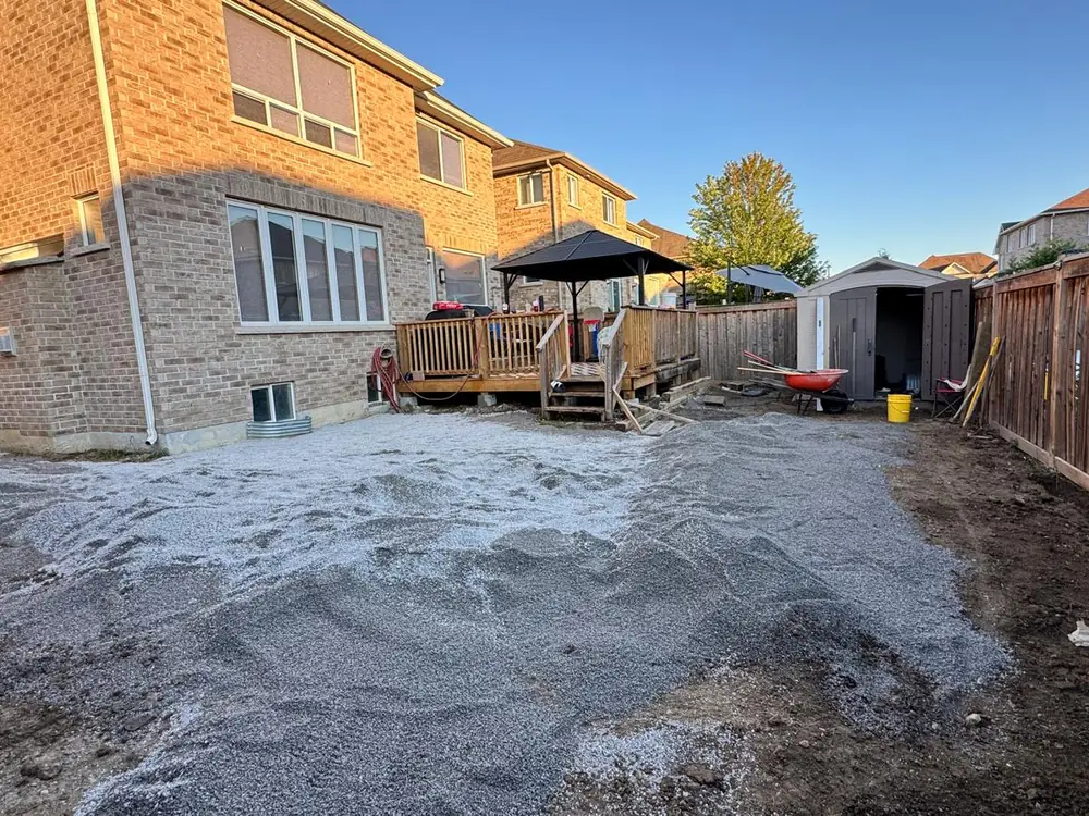 Granular base going down across the excavated yard
