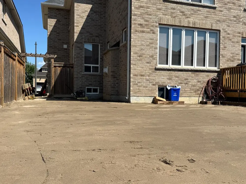 Screeded bedding course across a backyard