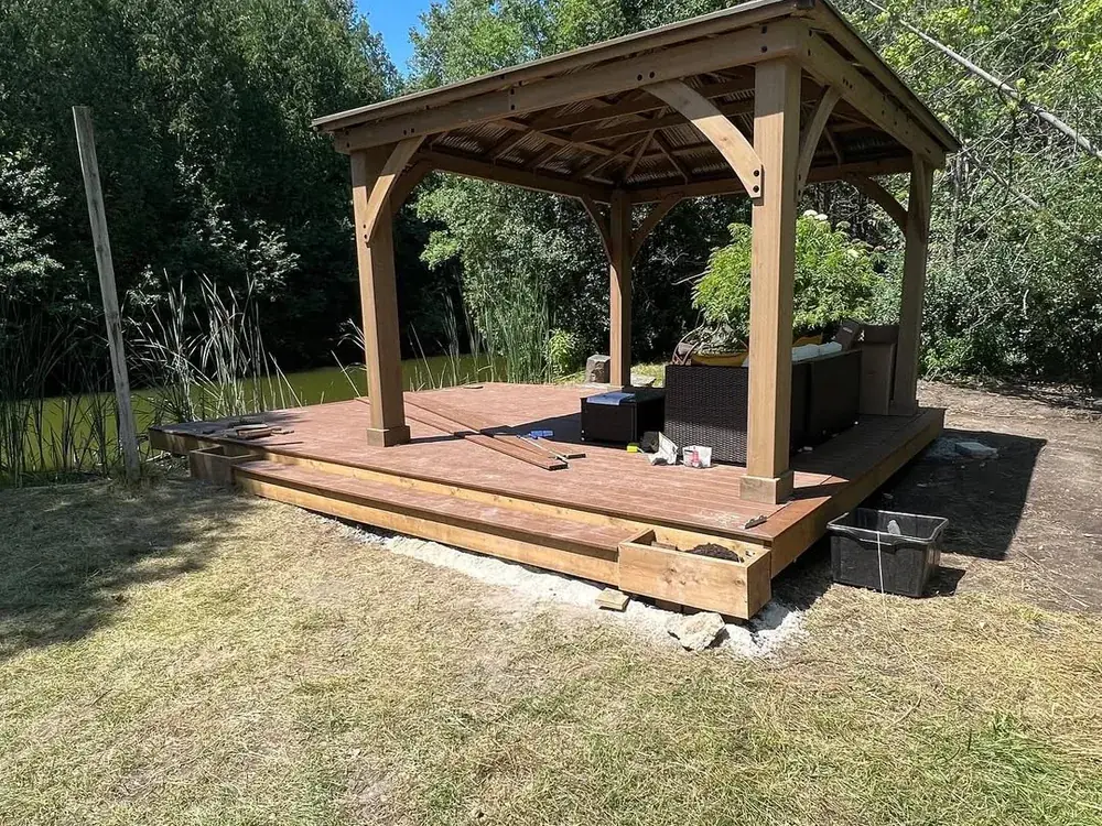 Cedar gazebo on the finished deck platform built over that same gravel pad