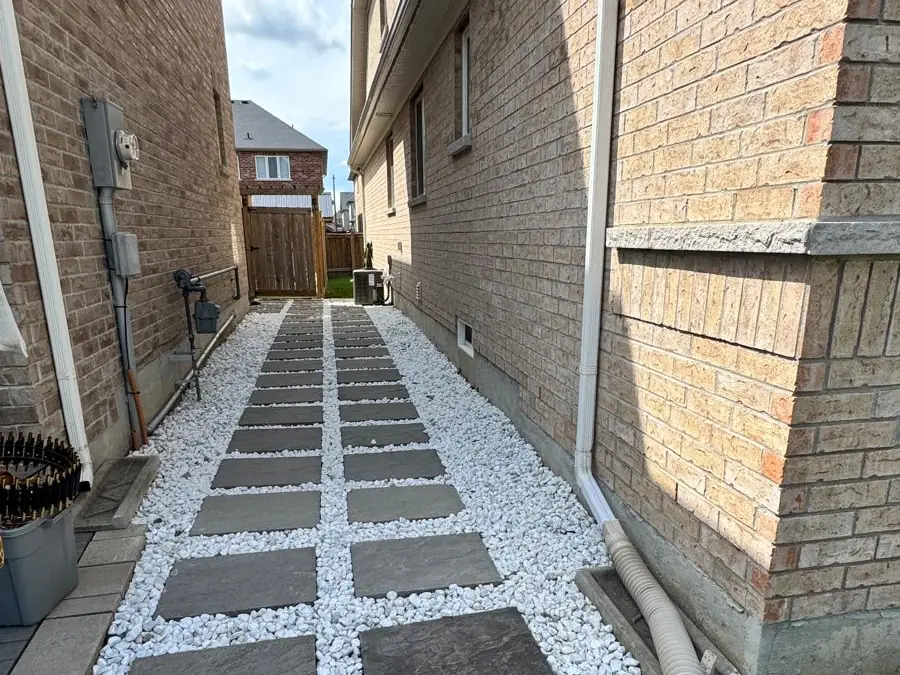 Finished paver walkway set in white decorative stone