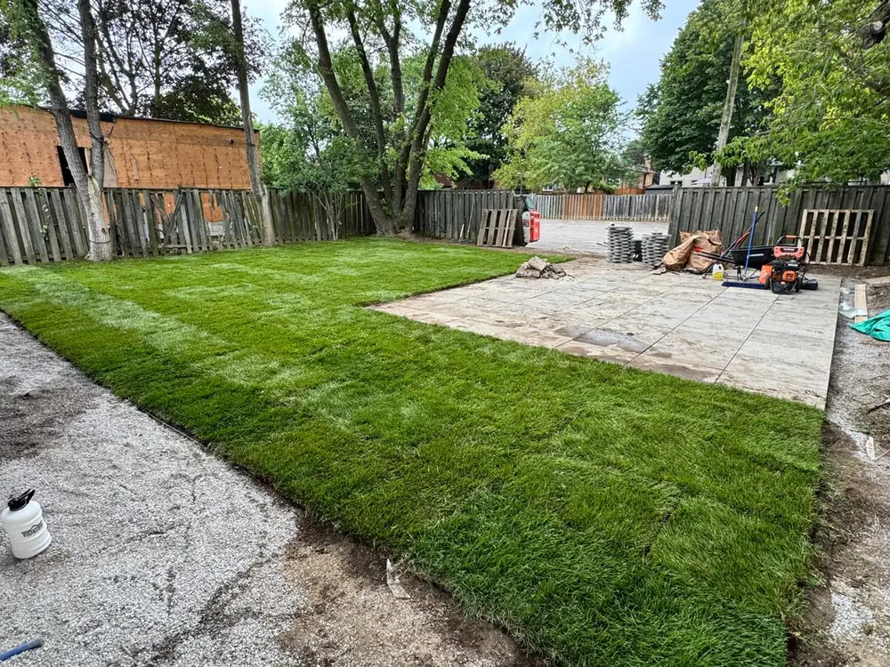The same yard finished with patio and sod
