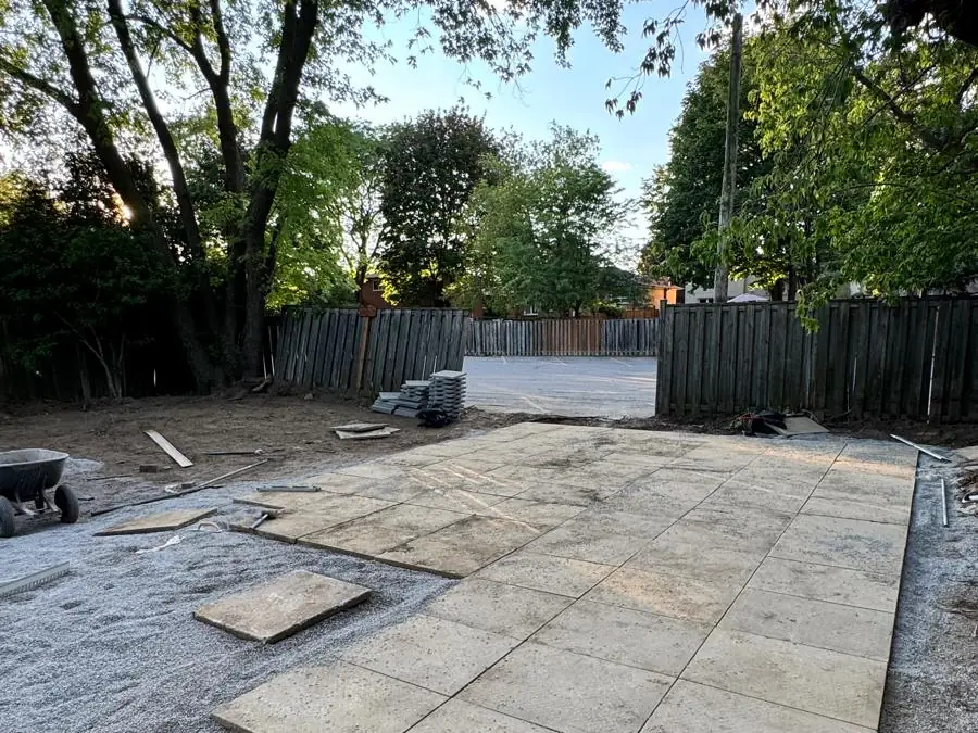 Large-format slabs being set onto the prepared base